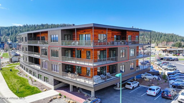 1579 W Riverstone Dr # 306, Coeur Dalene, ID 83814 - view of property featuring uncovered parking