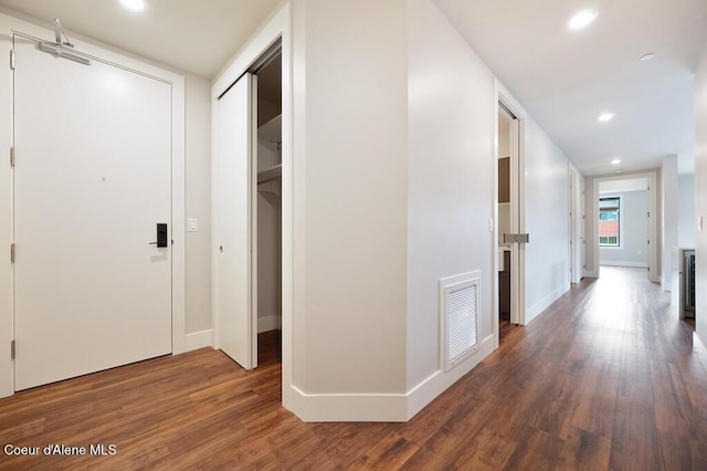 1579 W Riverstone Dr # 306, Coeur Dalene, ID 83814 - hallway with recessed lighting, wood finished floors, visible vents, and baseboards