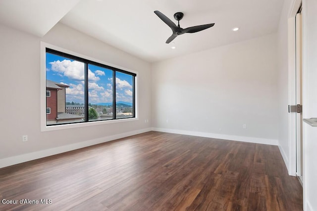 1579 W Riverstone Dr # 306, Coeur Dalene, ID 83814 - spare room featuring baseboards, recessed lighting, ceiling fan, and dark wood finished floors