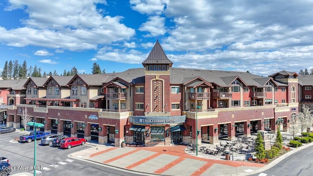 1579 W Riverstone Dr # 306, Coeur Dalene, ID 83814 - view of property with a residential view and uncovered parking