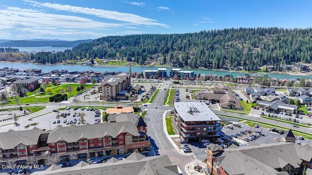 1579 W Riverstone Dr # 306, Coeur Dalene, ID 83814 - drone / aerial view with a water and mountain view and a wooded view