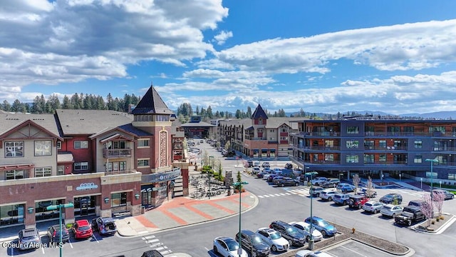 1579 W Riverstone Dr # 306, Coeur Dalene, ID 83814 - exterior space with street lights, curbs, and sidewalks