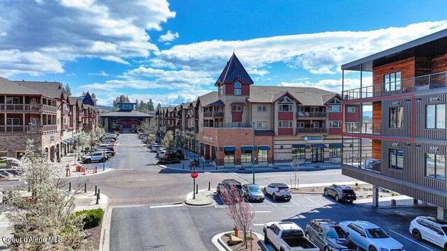 1579 W Riverstone Dr # 306, Coeur Dalene, ID 83814 - view of building exterior with a residential view and uncovered parking