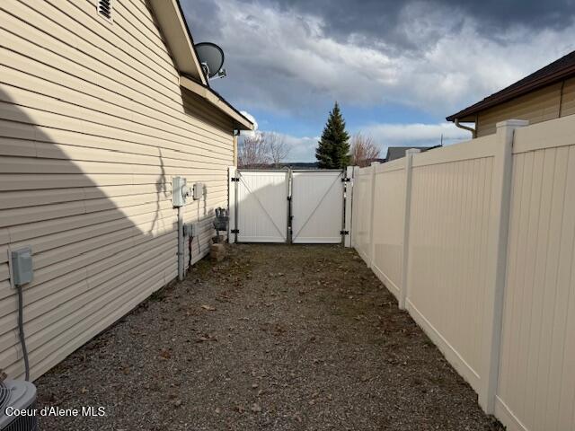 2359 N Alfalfa Loop, Post Falls, ID 83854 - view of side of property featuring fence and a gate