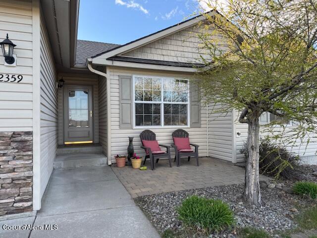 2359 N Alfalfa Loop, Post Falls, ID 83854 - property entrance with a shingled roof
