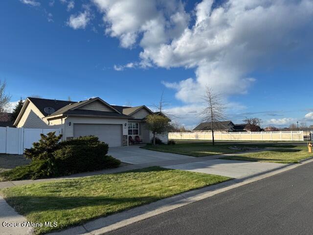 2359 N Alfalfa Loop, Post Falls, ID 83854 - ranch-style home featuring fence, a garage, driveway, and a front yard