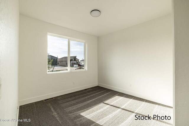 11506 N Clapton Ln, Rathdrum, ID 83858 - spare room with carpet floors and baseboards