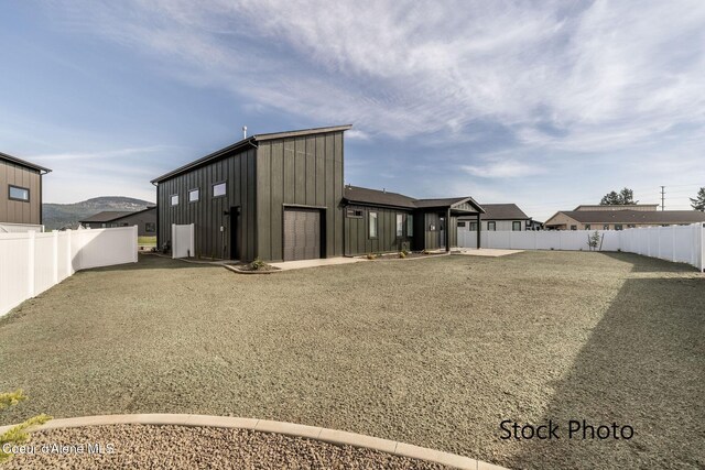 11506 N Clapton Ln, Rathdrum, ID 83858 - view of outdoor structure with a fenced backyard and a garage