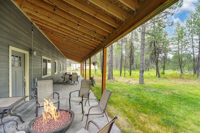 view of patio / terrace featuring a fire pit