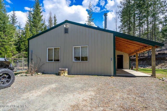 view of property exterior featuring a carport
