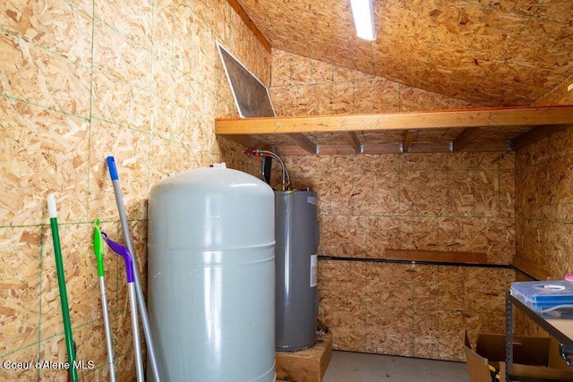 utility room featuring electric water heater