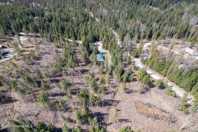 drone / aerial view with a view of trees