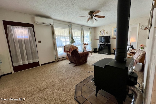 321 High St, Priest River, ID 83856 - living room with a wood stove, a wall mounted AC, a textured ceiling, carpet flooring, and ceiling fan