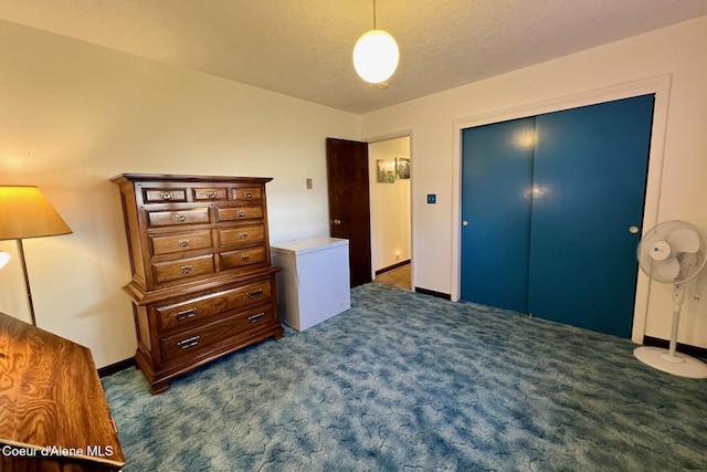 321 High St, Priest River, ID 83856 - bedroom featuring dark carpet, a closet, and fridge