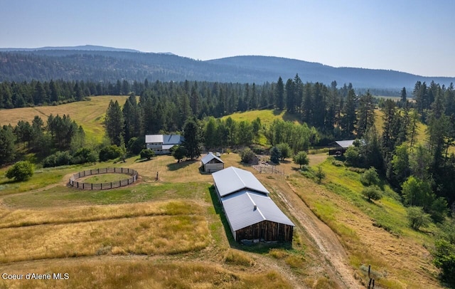 bird's eye view featuring a rural view, a view of trees, and a mountain view