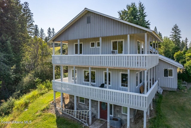 rear view of house featuring a balcony