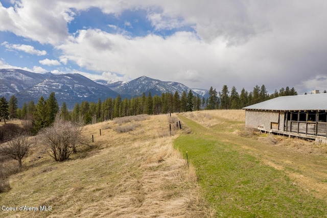 mountain view featuring a rural view