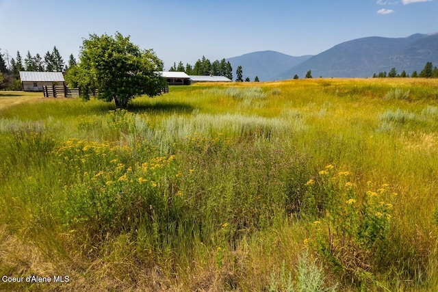 mountain view featuring a rural view