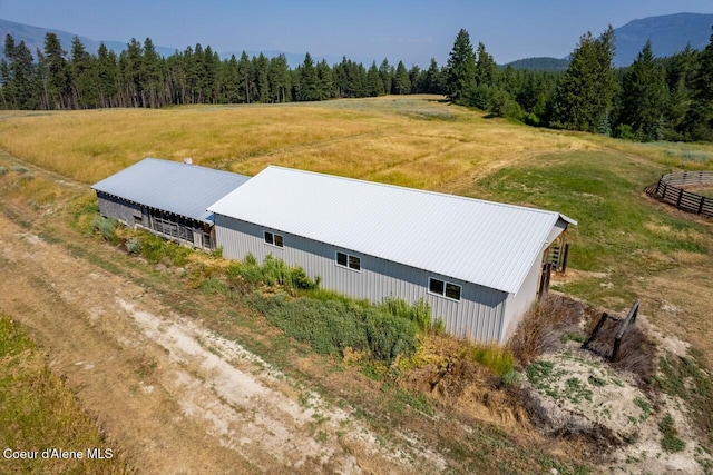 drone / aerial view with a rural view and a wooded view