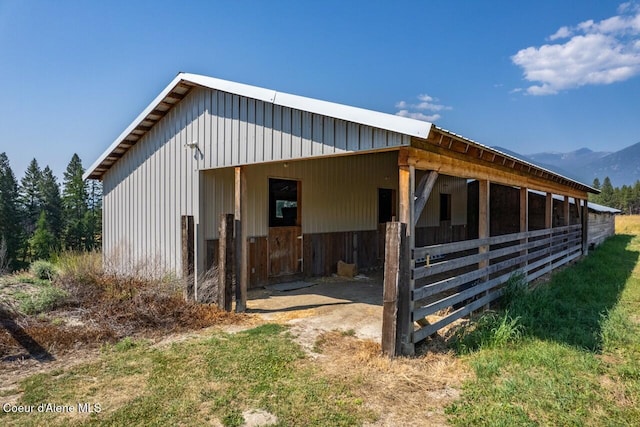 view of stable with a mountain view