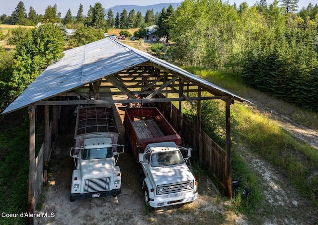 view of car parking with a mountain view