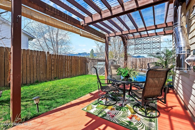 deck featuring outdoor dining area and a pergola
