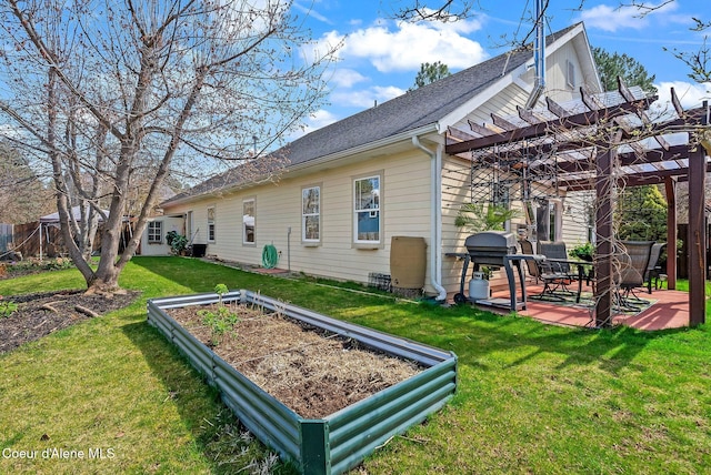 exterior space with a vegetable garden, a pergola, and a patio