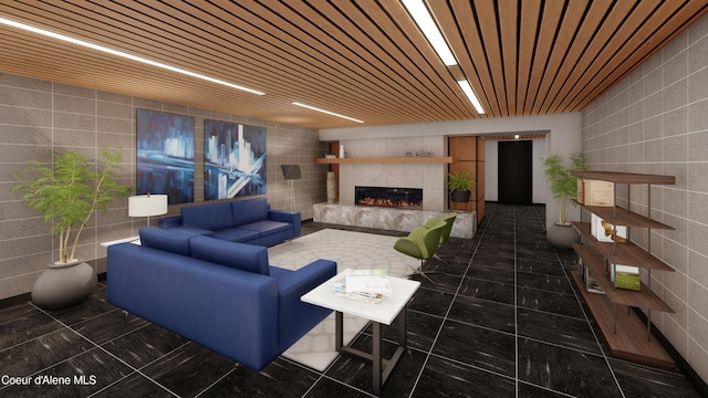 116 S 3rd St # 1304, Coeur Dalene, ID 83814 - living room with concrete block wall, tile walls, and a tiled fireplace