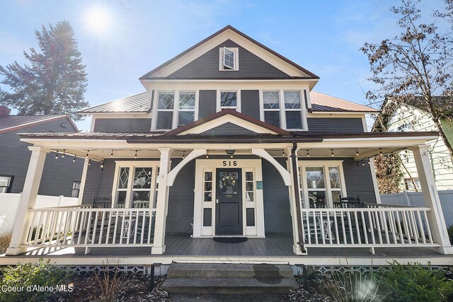 516 E Indiana Ave, Coeur Dalene, ID 83814 - view of front of house with fence and covered porch
