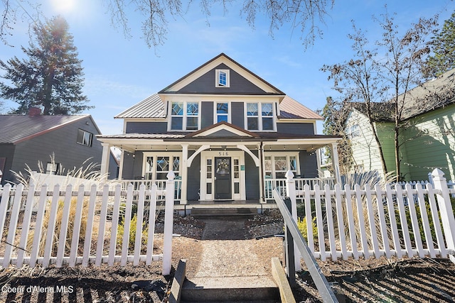 516 E Indiana Ave, Coeur Dalene, ID 83814 - view of front of property with a porch, fence private yard, and metal roof