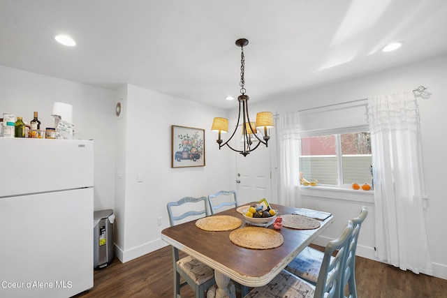 516 E Indiana Ave, Coeur Dalene, ID 83814 - dining space with an inviting chandelier, baseboards, recessed lighting, and dark wood-style flooring