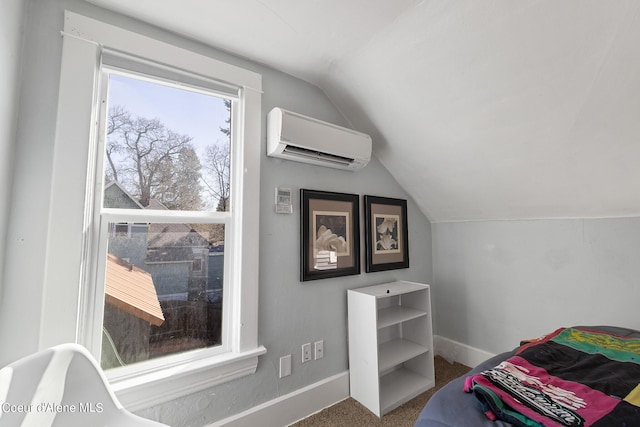 516 E Indiana Ave, Coeur Dalene, ID 83814 - bedroom with baseboards, lofted ceiling, carpet floors, and a wall unit AC