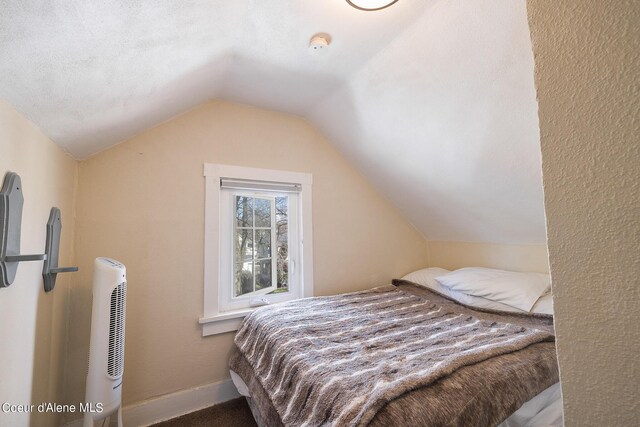 516 E Indiana Ave, Coeur Dalene, ID 83814 - bedroom with lofted ceiling and baseboards
