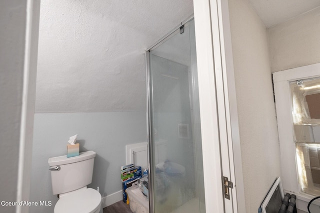 516 E Indiana Ave, Coeur Dalene, ID 83814 - bathroom with lofted ceiling, toilet, visible vents, and a stall shower