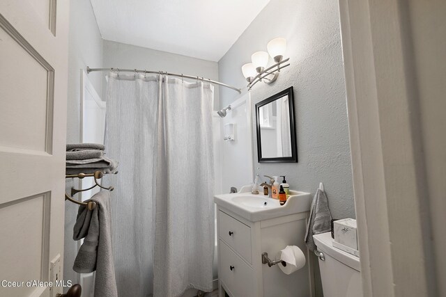 516 E Indiana Ave, Coeur Dalene, ID 83814 - bathroom featuring vanity, curtained shower, and toilet