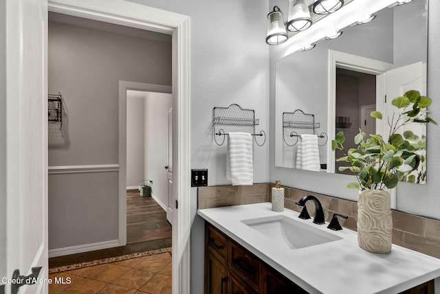 3825 E English Point Rd, Hayden, ID 83835 - bathroom with vanity, backsplash, and tile patterned flooring