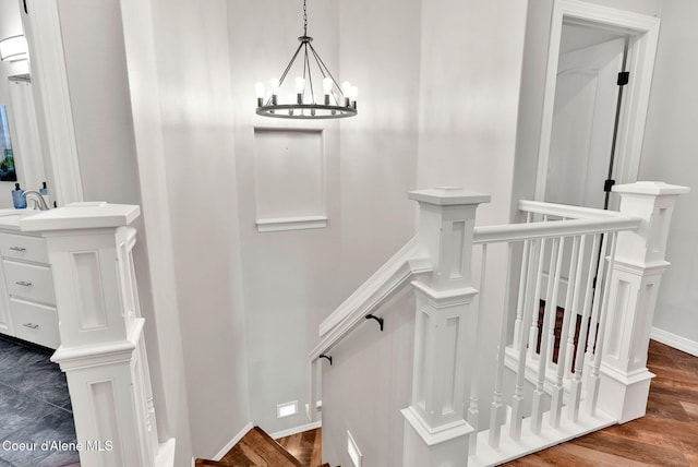 3825 E English Point Rd, Hayden, ID 83835 - stairway with wood finished floors and a chandelier