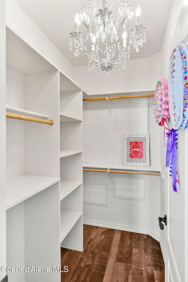 3825 E English Point Rd, Hayden, ID 83835 - spacious closet with a chandelier and wood finished floors