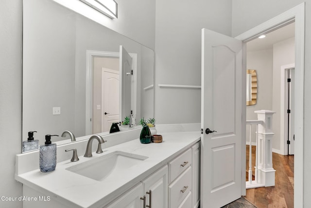 3825 E English Point Rd, Hayden, ID 83835 - bathroom featuring vanity and wood finished floors