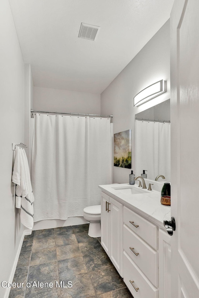 3825 E English Point Rd, Hayden, ID 83835 - full bath featuring vanity, stone finish flooring, and a shower with shower curtain