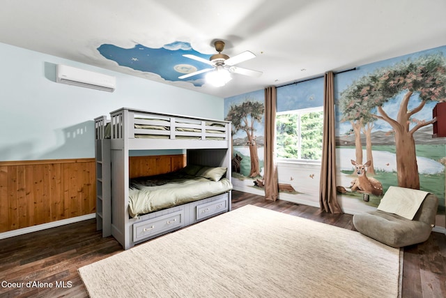 3825 E English Point Rd, Hayden, ID 83835 - bedroom with a wall unit AC, wainscoting, wood finished floors, a ceiling fan, and wooden walls