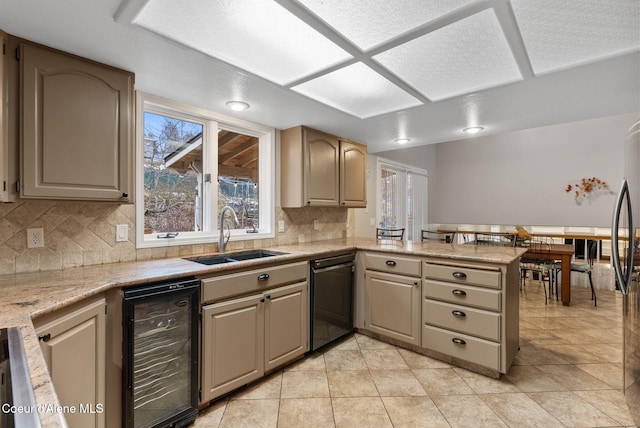 kitchen featuring tasteful backsplash, a sink, a peninsula, black dishwasher, and wine cooler