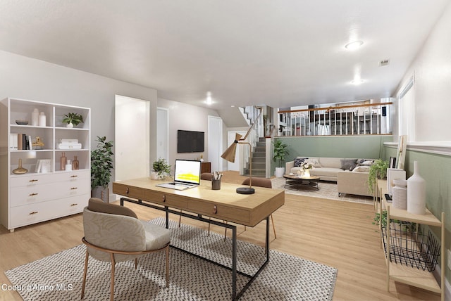 home office featuring light wood-style floors and visible vents