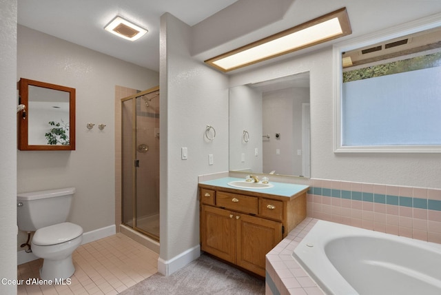 bathroom with tile patterned flooring, toilet, vanity, a bath, and a stall shower