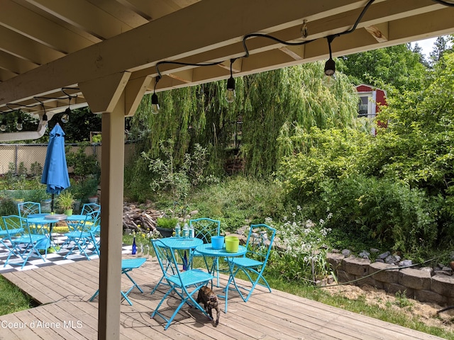 deck with fence and outdoor dining space