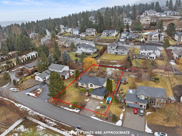bird's eye view with a forest view and a residential view