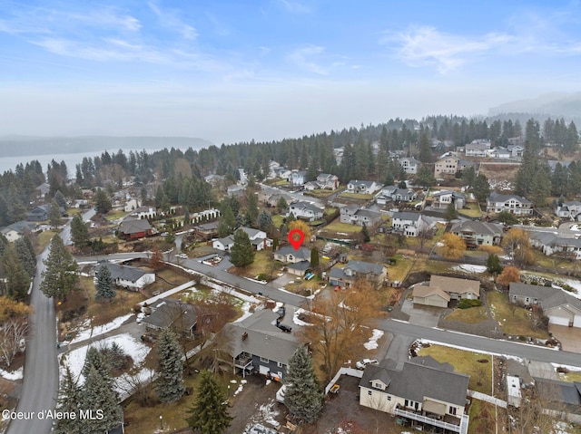 aerial view with a residential view and a view of trees
