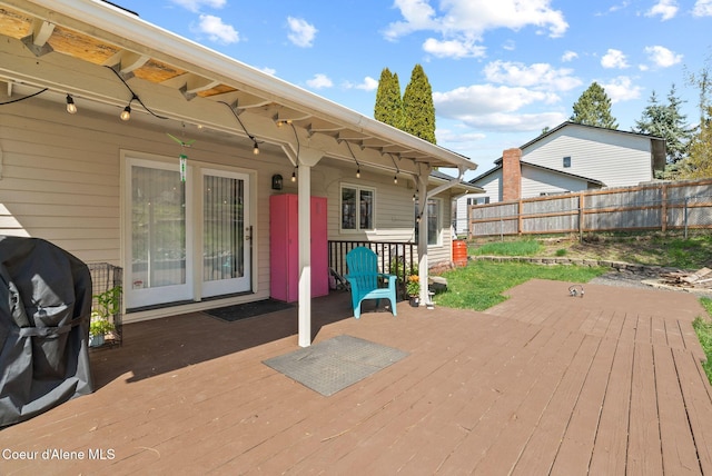 wooden deck featuring fence and grilling area