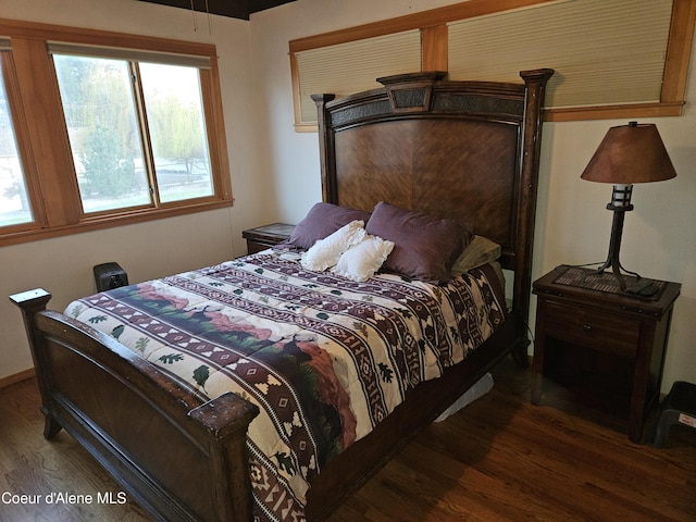11268 N Friar Dr, Hayden, ID 83835 - bedroom with wood finished floors and multiple windows