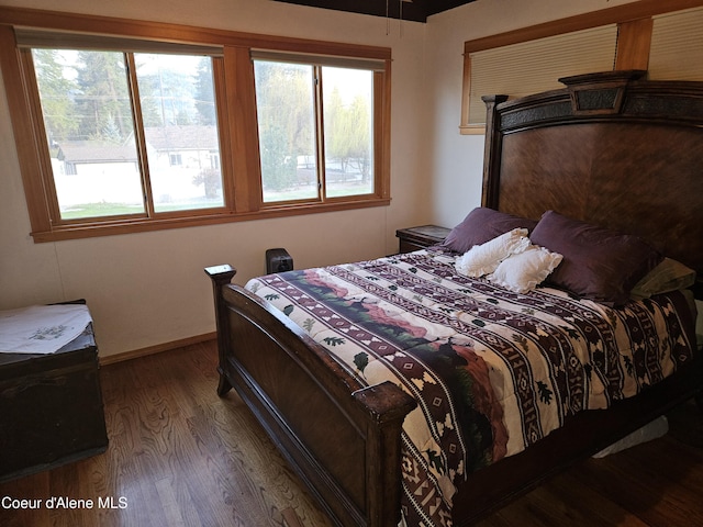 11268 N Friar Dr, Hayden, ID 83835 - bedroom with baseboards and dark wood-style floors